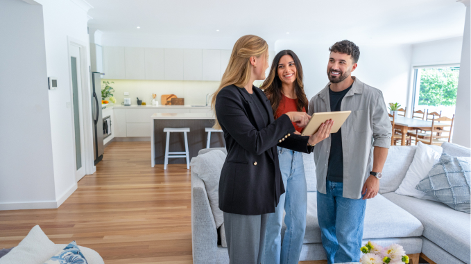 Couple speaking to a real estate agent